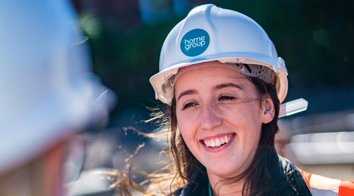 Kate smiling with hard hat on.